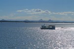 Sun on the water of Pumicestone Passage, looking over to Glass House Mountains