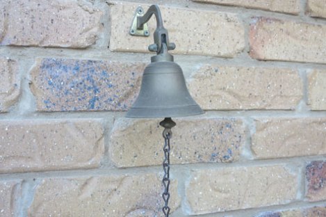 Bell on a brick wall