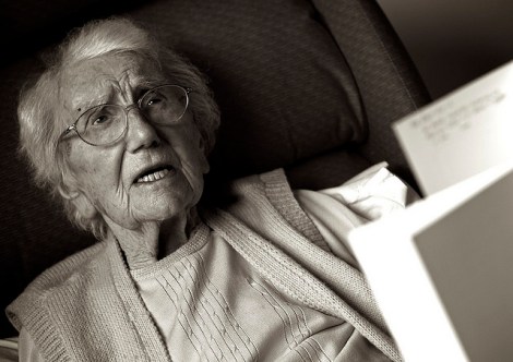 elderly woman with paperwork