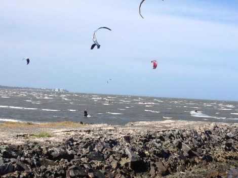 Kitesurfers ply the waters of Bramble Bay